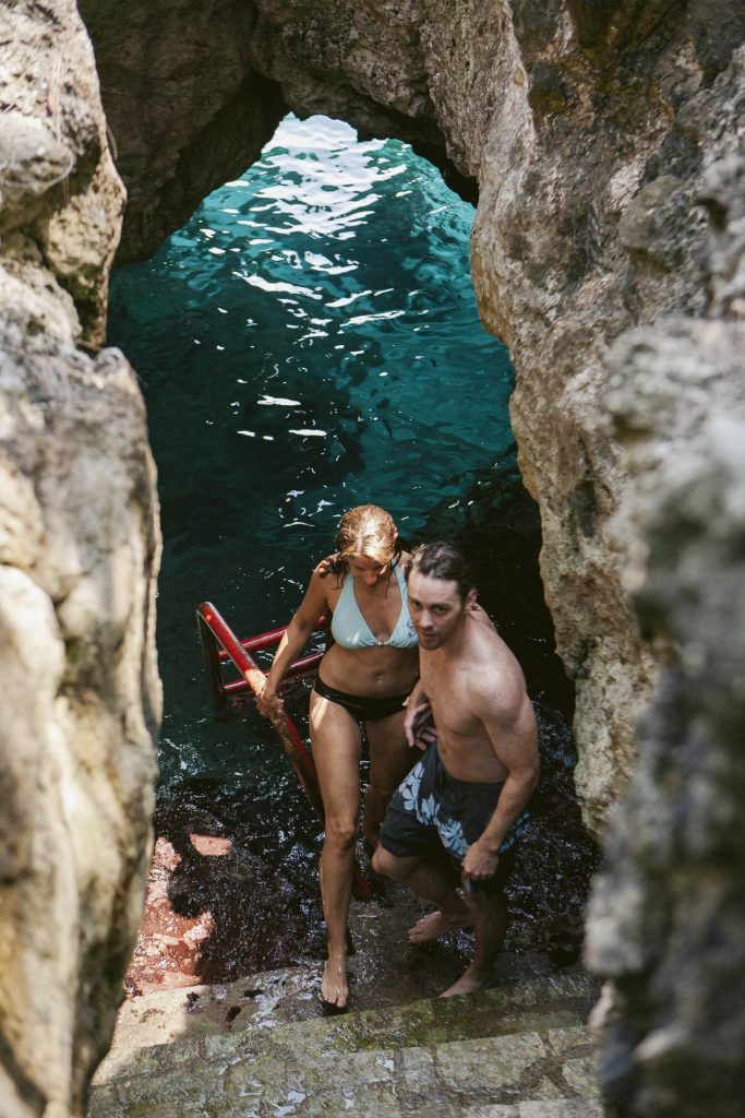 Rockhouse Hotel, Negril, Jamaica: A man and woman walking up a path after swimming in an ocean grotto.