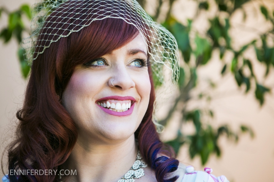 photo of bride at wedding with red hair and birdcage veil
