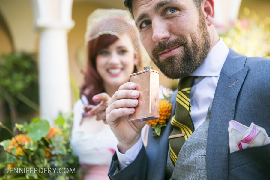 photo of groom with vintage copper flask and vintage clothing for wedding