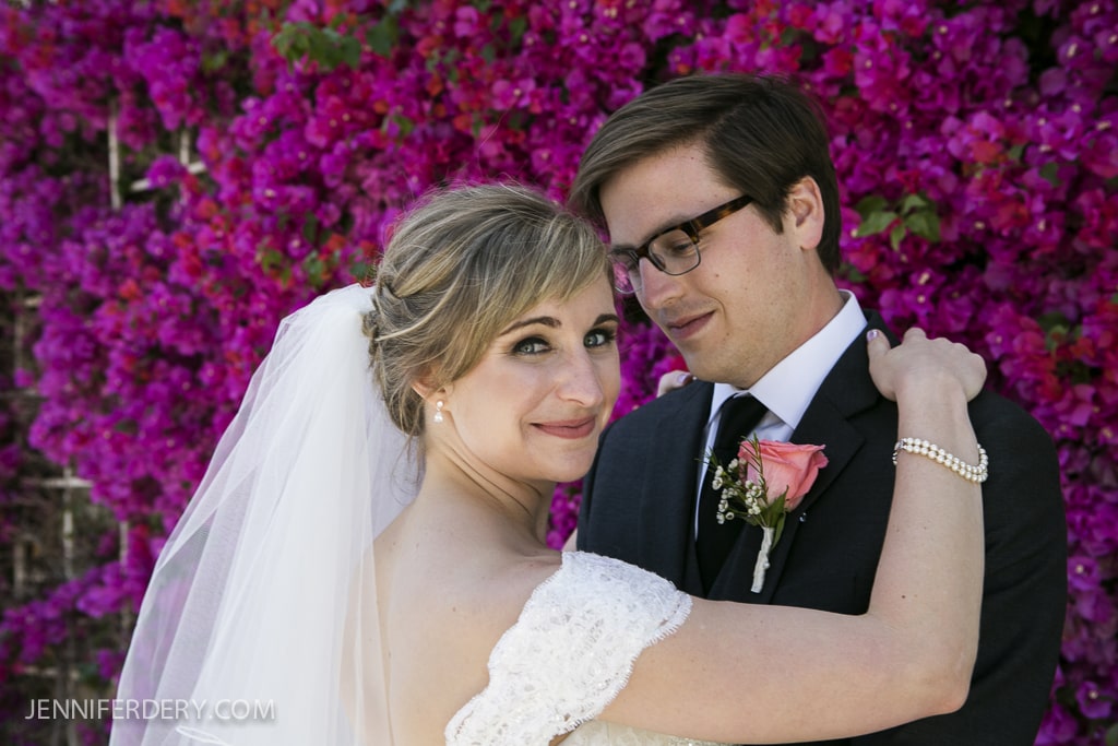 photos of bride and groom in front of dark pink bougainvillea plant backdrop