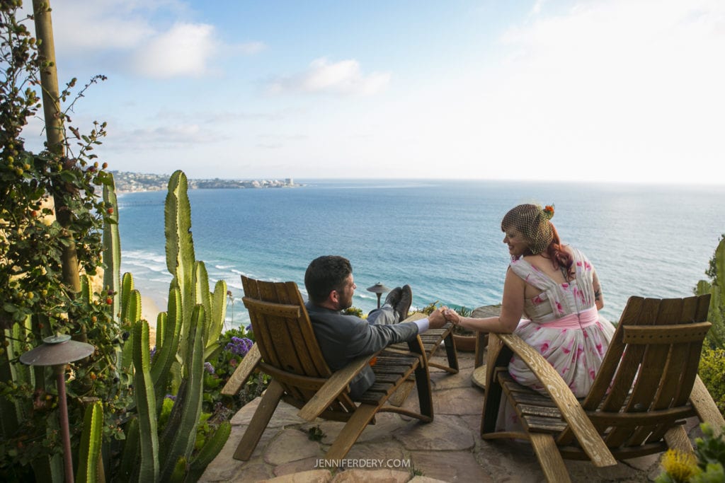 wedding couple seated on a cliff side patio at La Jolla Farms Estates