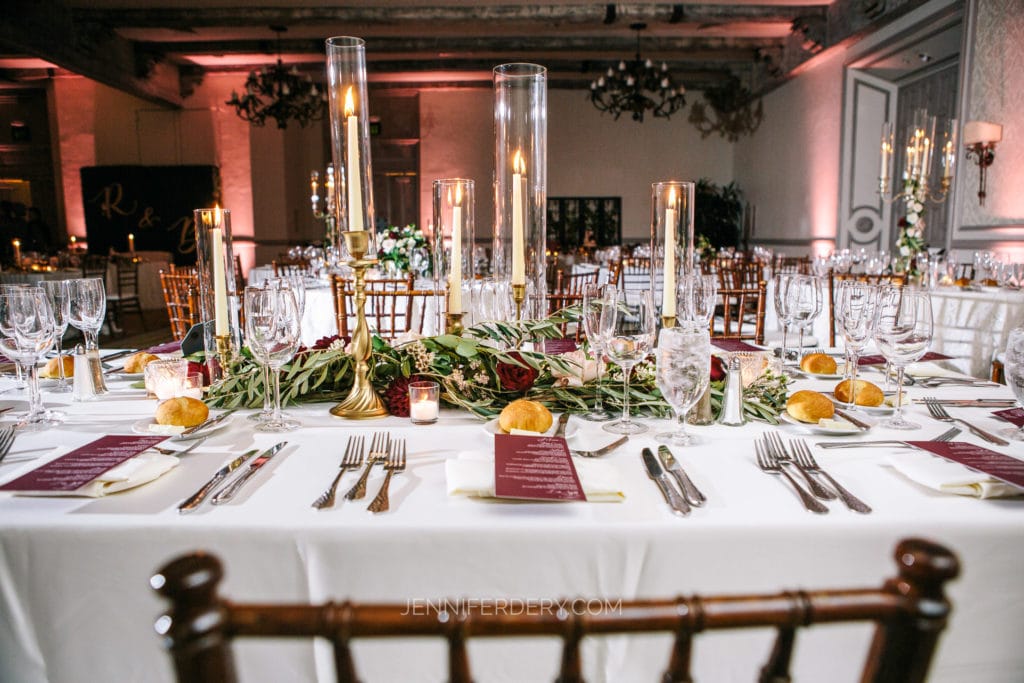 create your own light to photograph a wedding reception table like the own shown in a large dark ballroom