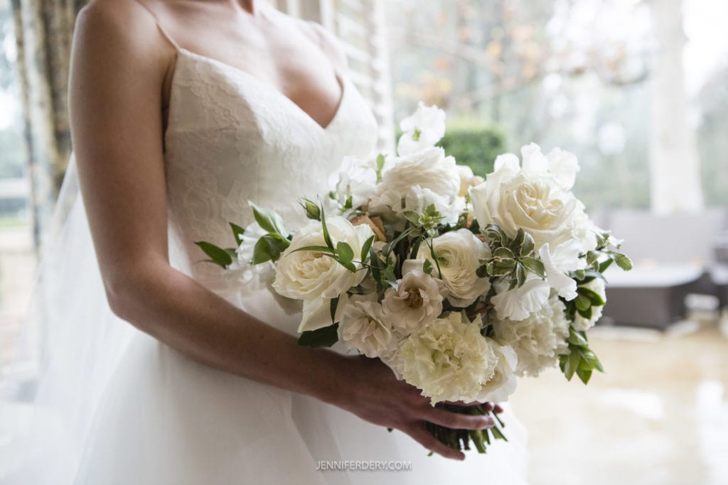 large all white flower bridal bouquet in spring with white ballet-style wedding dress