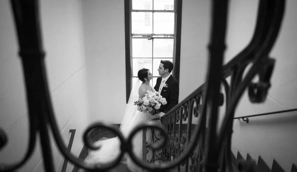 black and white wedding photo of couple on campus at usd in a stairwell