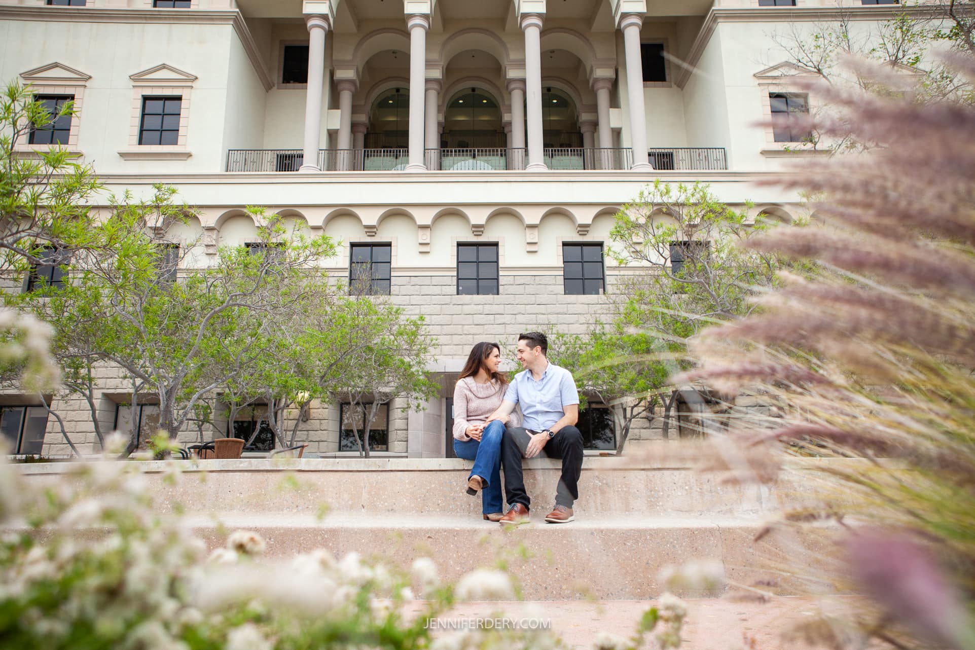 newly engaged couple being photographed on the campus of USD