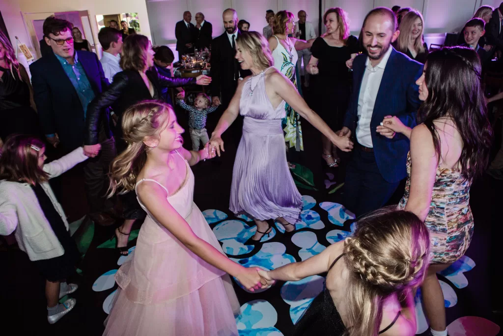 Palo Alto Bat Mitzvah for Megan shown during the hora surrounded by a circle of family and friends
