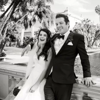 photo of a wedding couple at the koi pond in balboa park. bride is in a white dress, groom in wearing a black tuxedo. photo is used as a sample of getting started as a professional photographer article