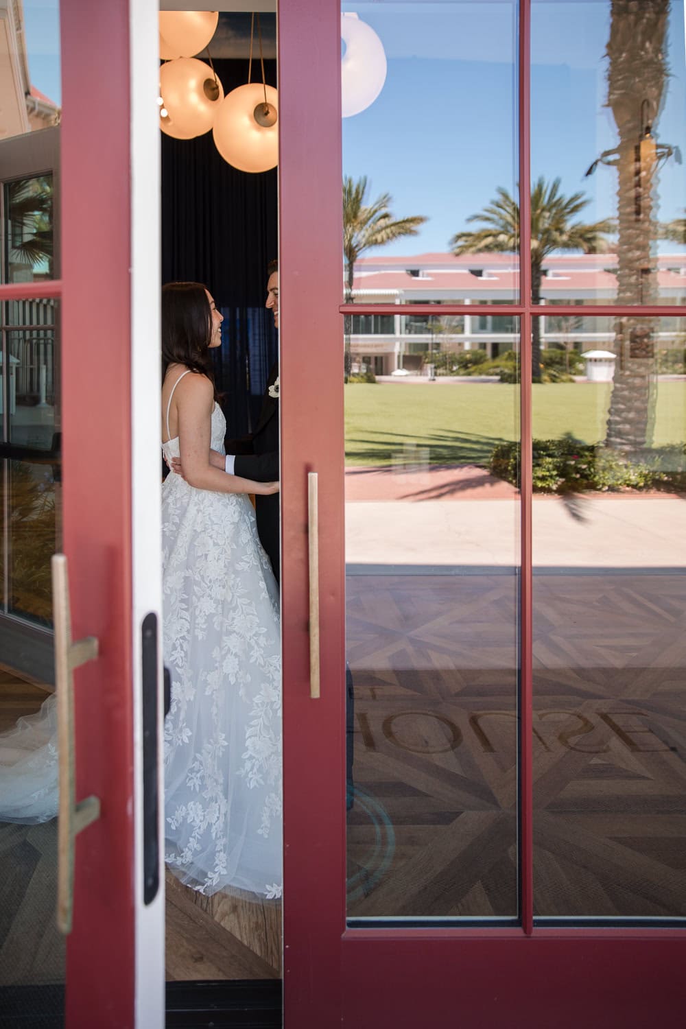 outside Southpointe Ballroom event center with wedding couple at the Hotel Del Coronado