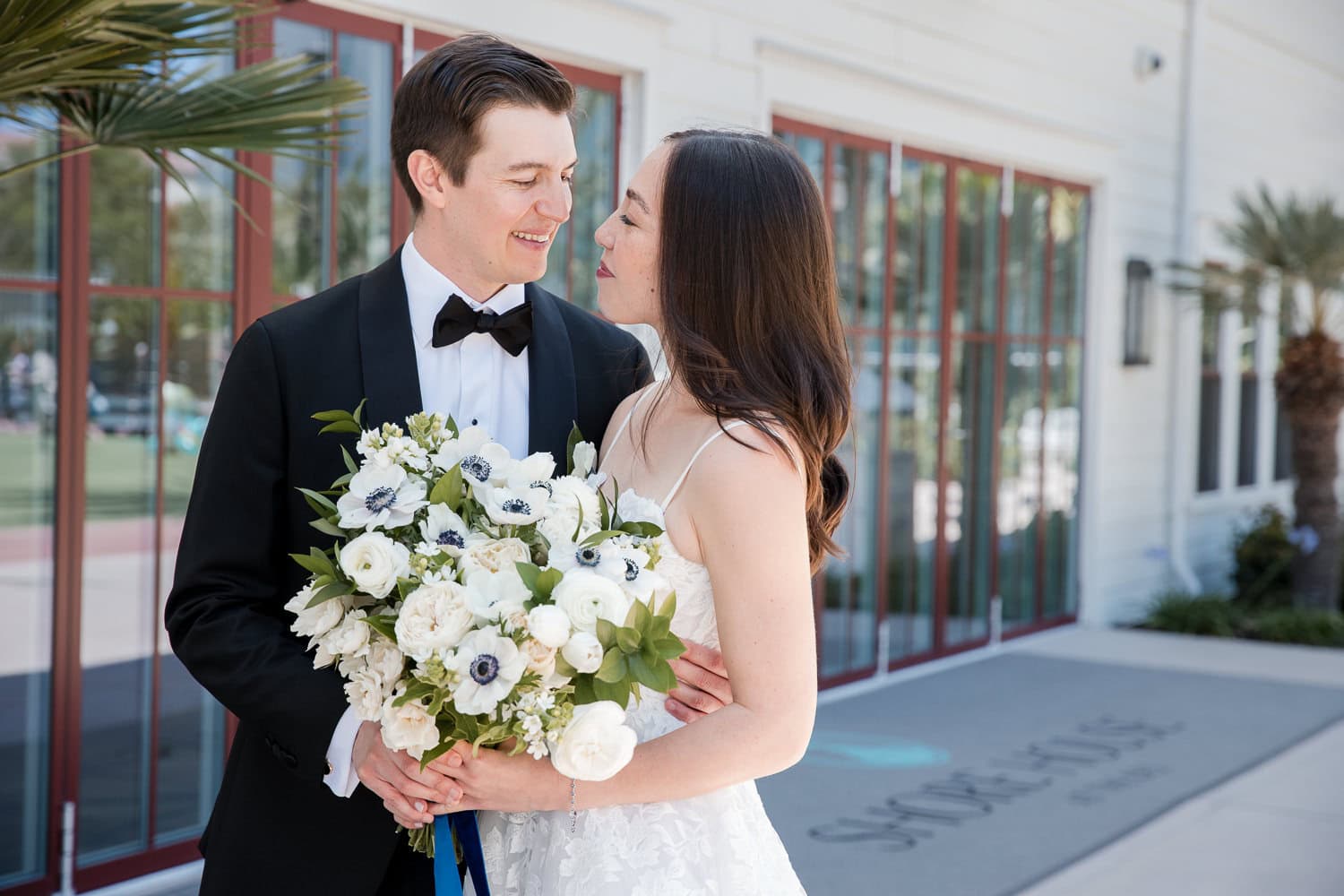 outside Southpointe Ballroom event center with wedding couple at the Hotel Del Coronado