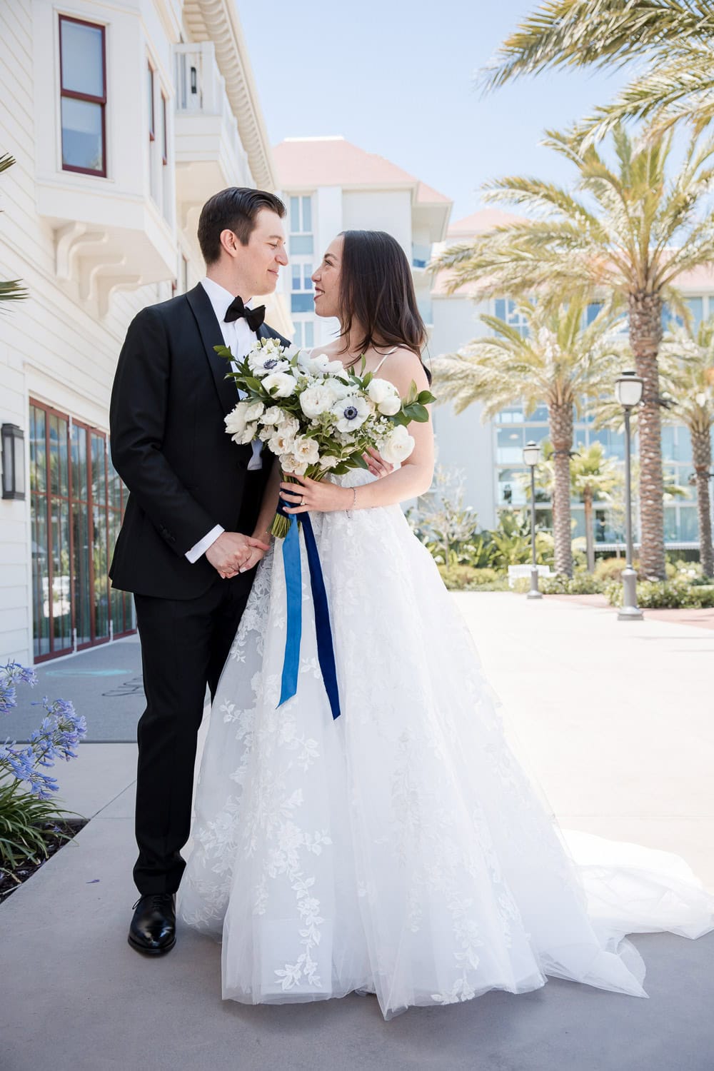 outside Southpointe Ballroom event center with wedding couple at the Hotel Del Coronado