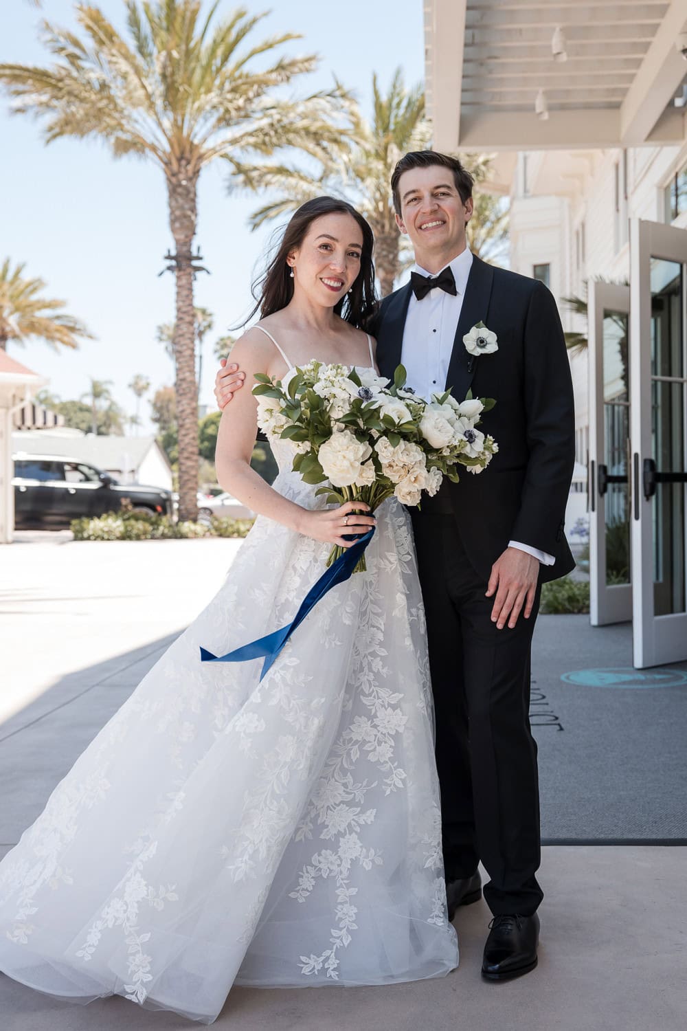 outside Southpointe Ballroom event center with wedding couple at the Hotel Del Coronado