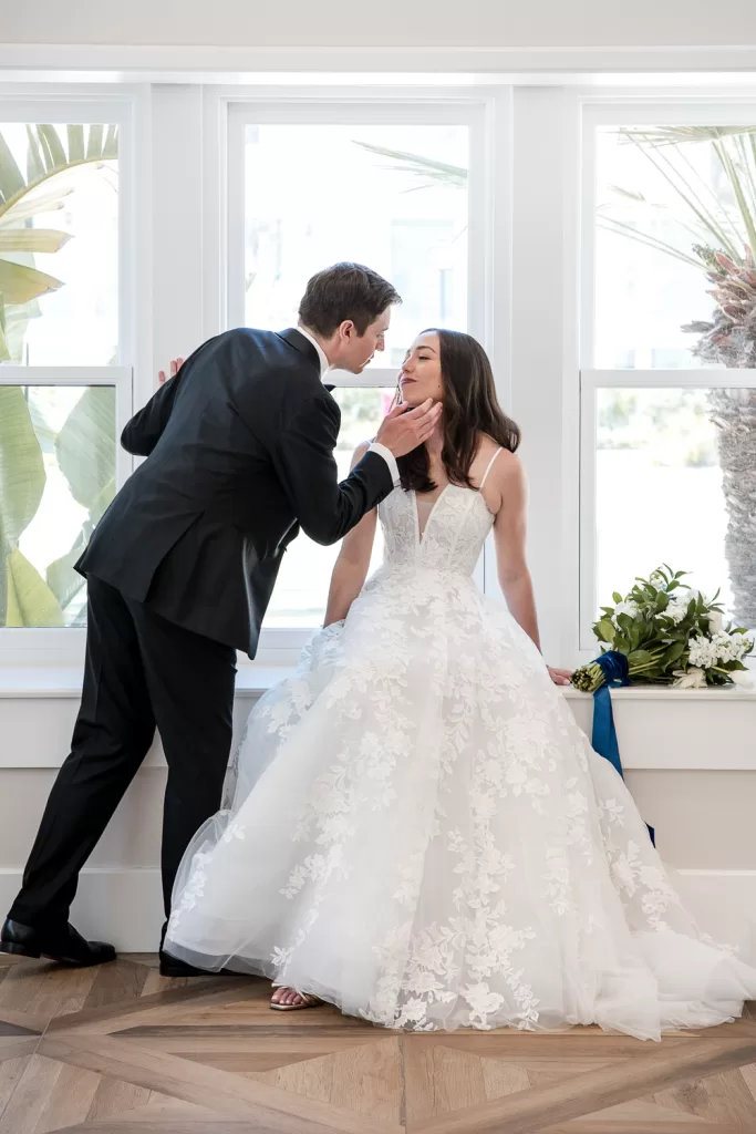 photo of bride and groom almost sharing a kiss outside the southpointe ballroom at the hotel del coronaso