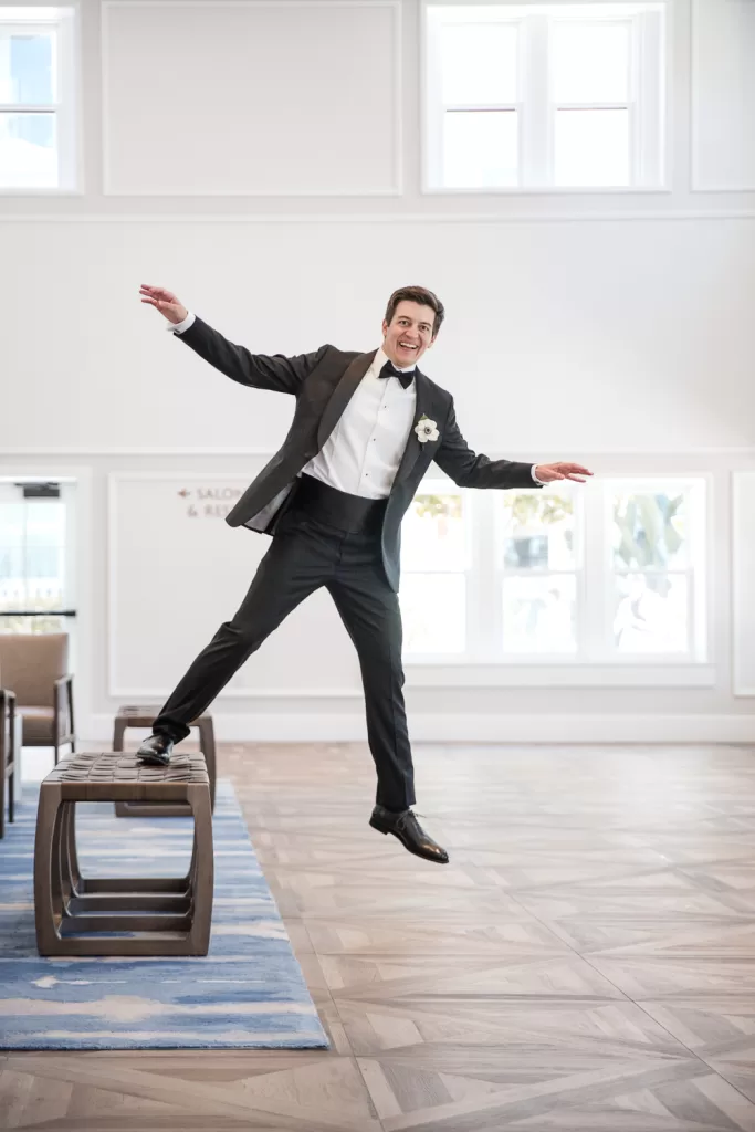 photo of a groom being goofy for his portrait session