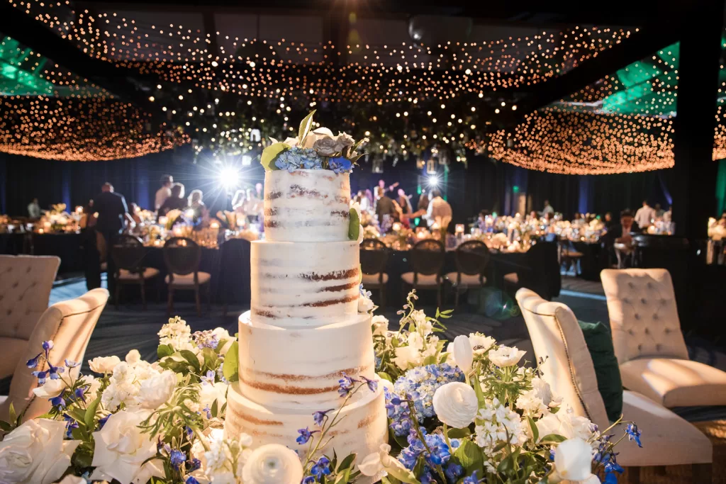 Southpointe Ballroom event center decor using navy and white with candles and wedding cake